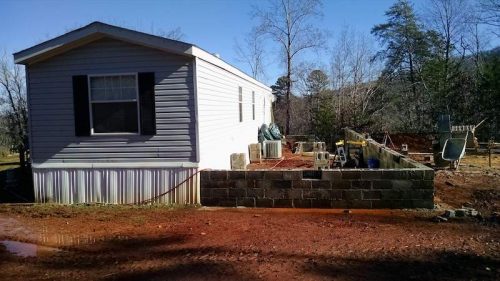 Building a Two-Story Addition onto a Manufactured Home - the single wide with the foundation of the addition