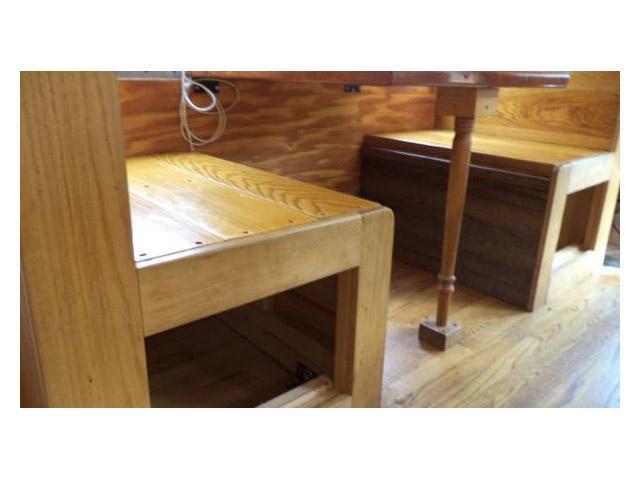vintage buses-built in dining table with custom woodwork in 1997 Bluebird International bus